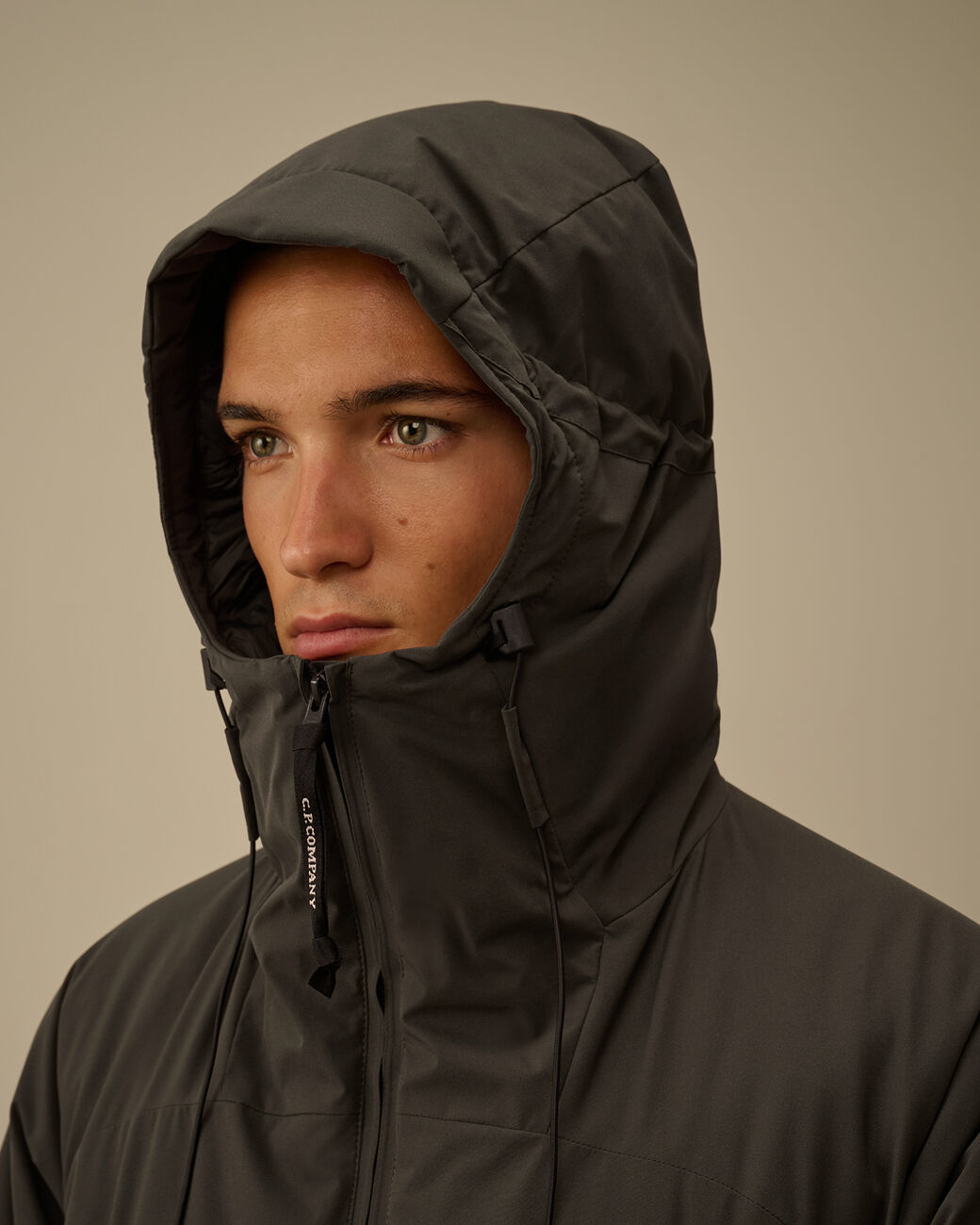 Pro-Tek Hooded Padded Jacket CP Company® AW25 - Dark Shadow